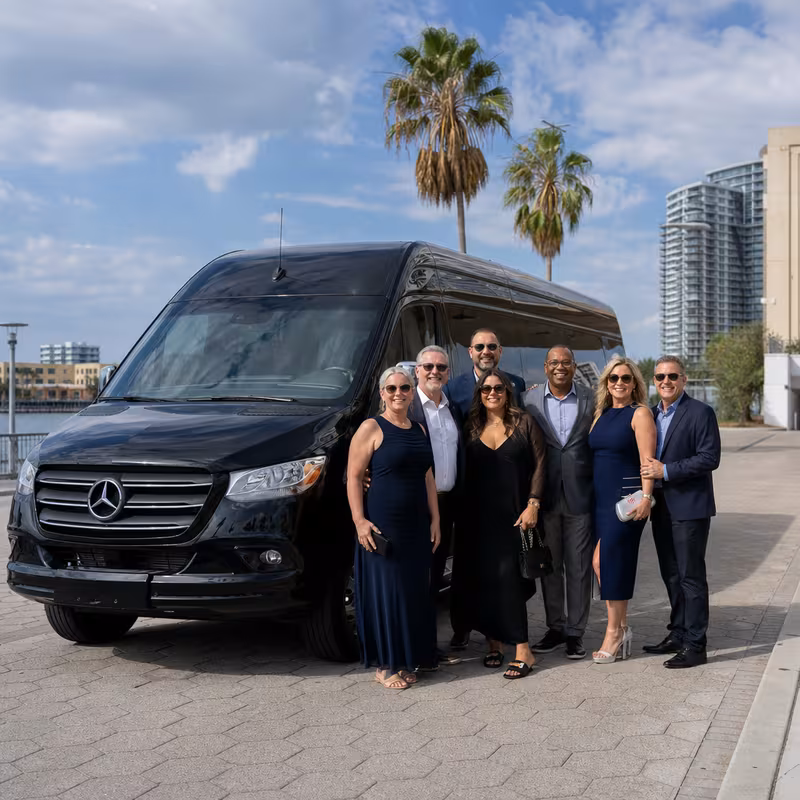 Group beside a Mercedes Sprinter limo from the Tampa fleet