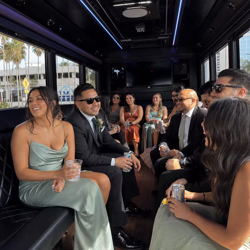 Wedding guests seated inside a Tampa party bus