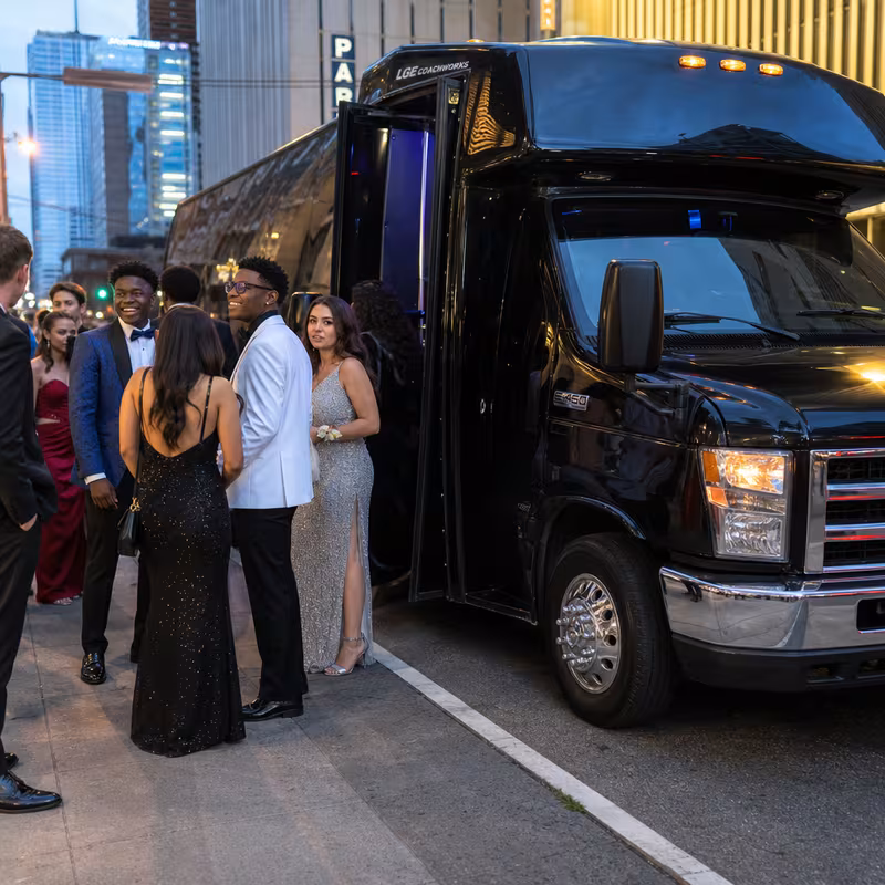 Passengers loading luggage while boarding an Tampa group shuttle