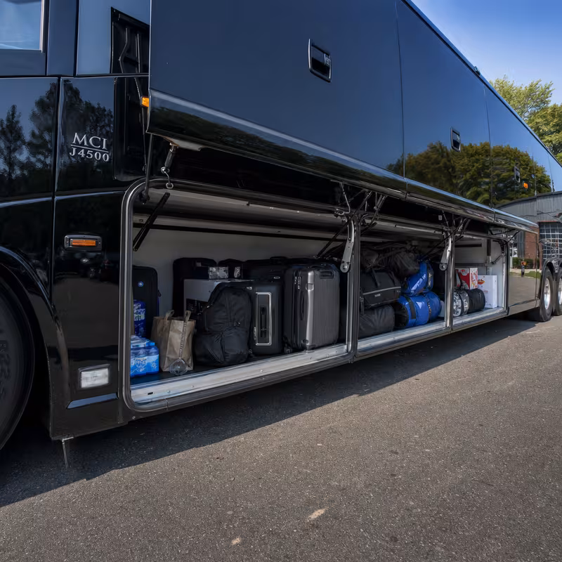Party bus interior with wraparound leather seating and LED lighting in Tampa