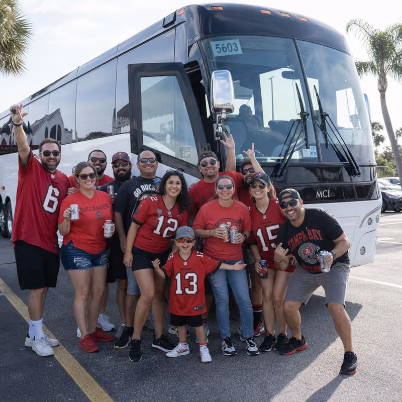 Passengers loading luggage while boarding an Tampa group shuttle