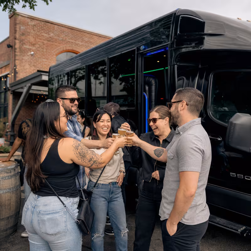 Passengers loading luggage while boarding an Tampa group shuttle